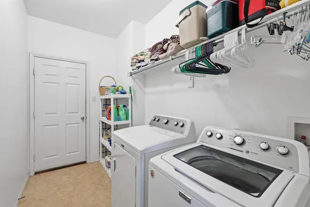 a bathroom with a sink a toilet and a large mirror