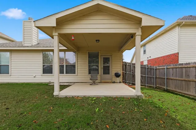 a view of a back yard with a small garden