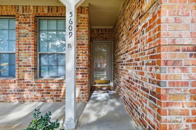a view of a brick buildings with an outdoor space