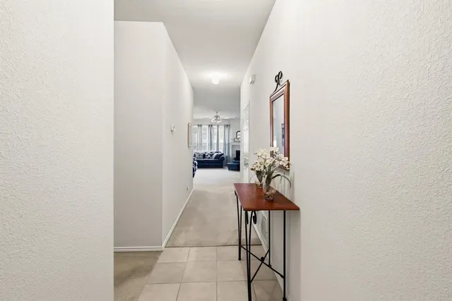 view of hall way with mirror