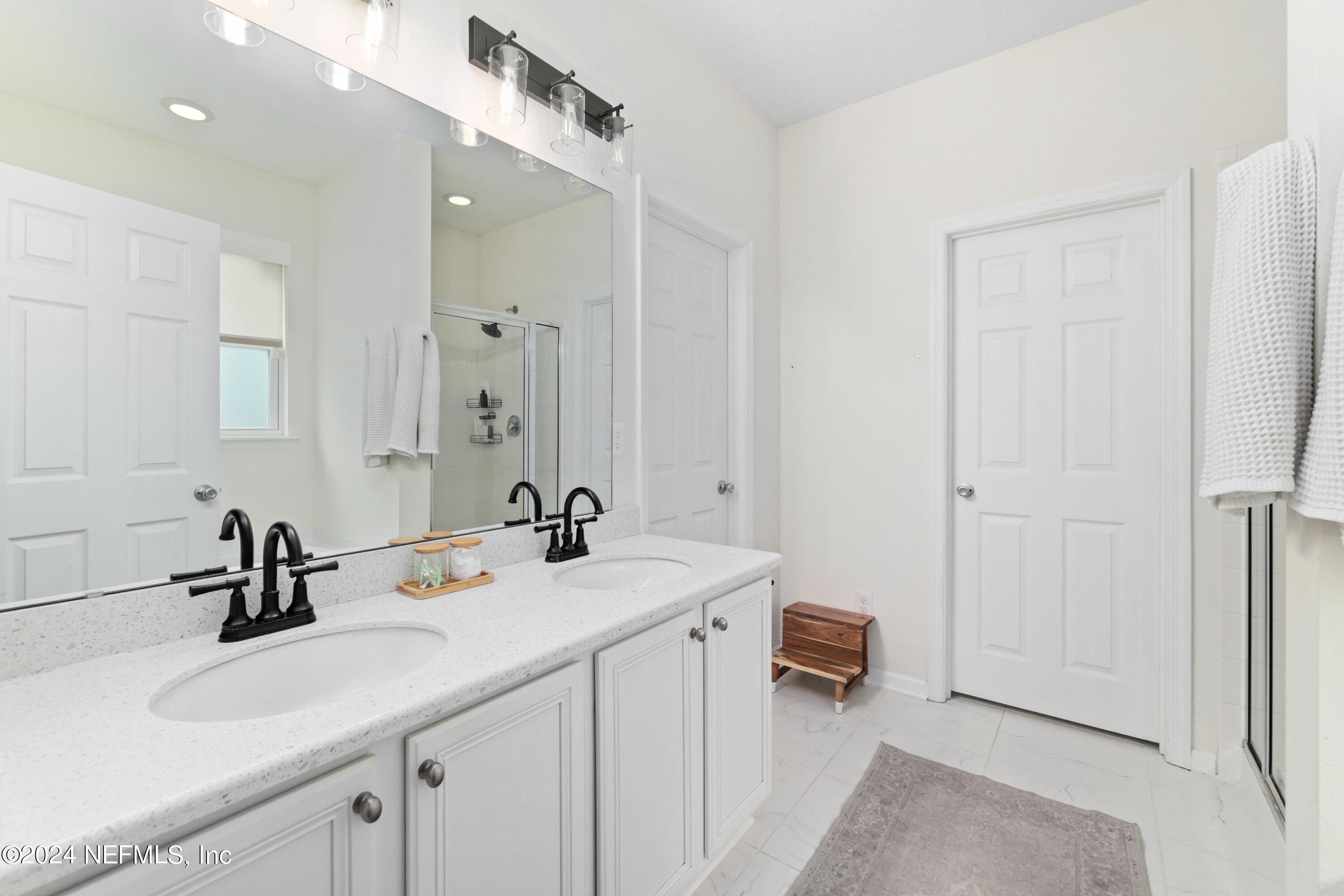 192 Peter Island Drive St. Augustine, FL 32092 - Photo 19 of 43 a en suite bathroom with a sink double vanity and a mirror