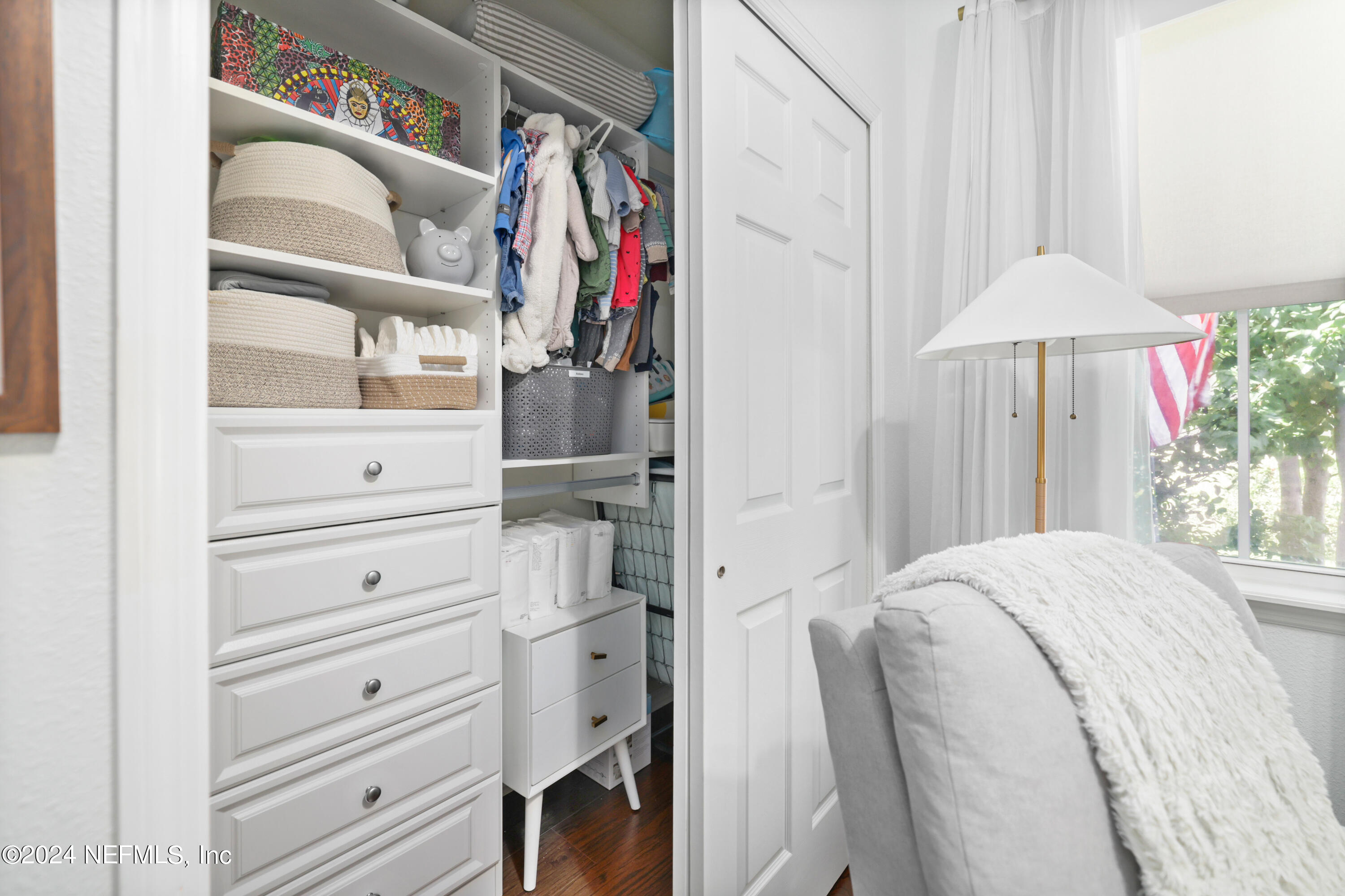 192 Peter Island Drive St. Augustine, FL 32092 - Photo 24 of 43 a view of walk in closet with clothes and shoes