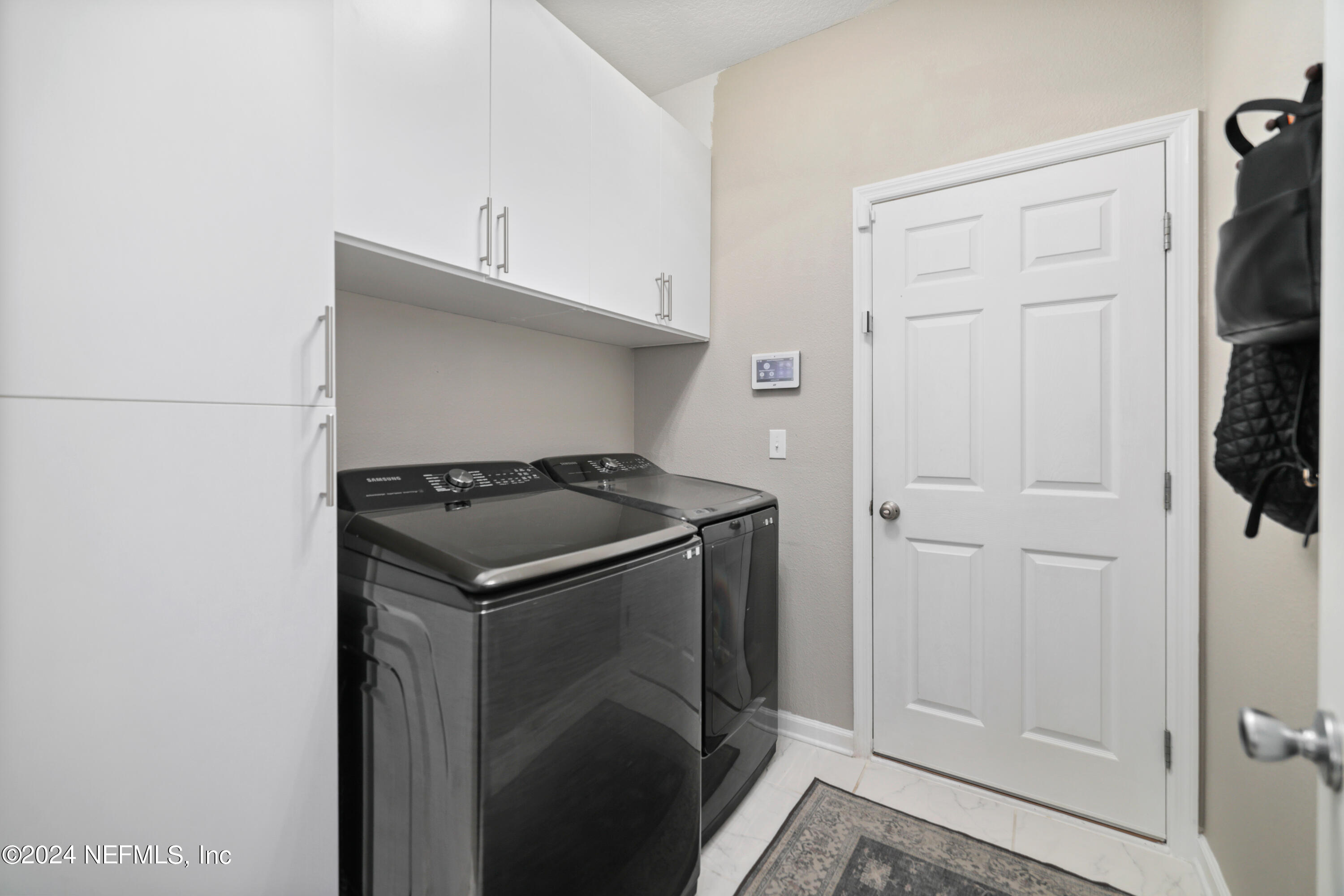192 Peter Island Drive St. Augustine, FL 32092 - Photo 27 of 43 a utility room with washer and dryer