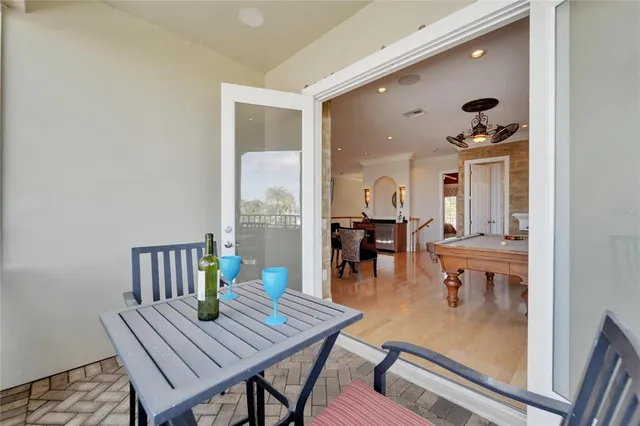 an aerial view of a house with a garden and lake view