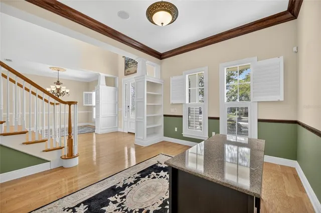 a view of a dining room with furniture window and outside view