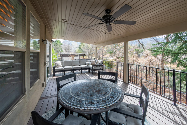 1456 Firelight Way Sandy, UT 84092 - Photo 20 of 22 Deck featuring an outdoor living / dining area and a ceiling fan