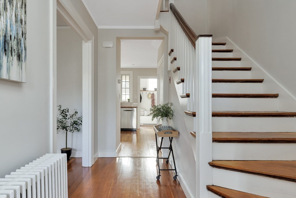 10 Shady Hill Square Cambridge, MA 02138 - Photo 14 of 37 a view of entryway with wooden floor and stairs