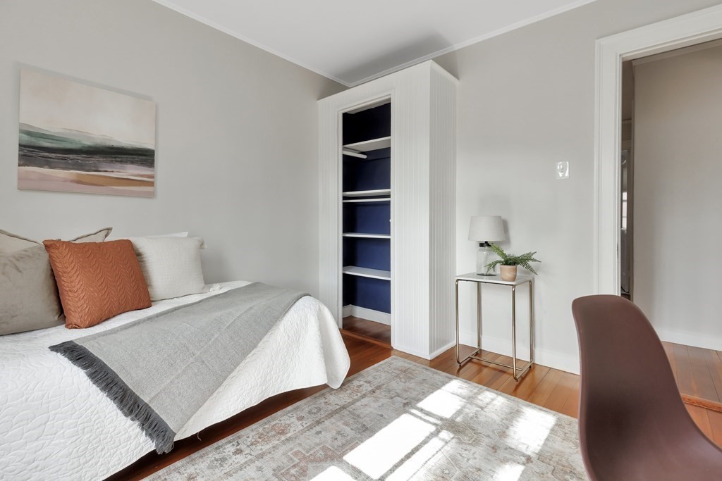 10 Shady Hill Square Cambridge, MA 02138 - Photo 17 of 37 a bedroom with a bed and chair