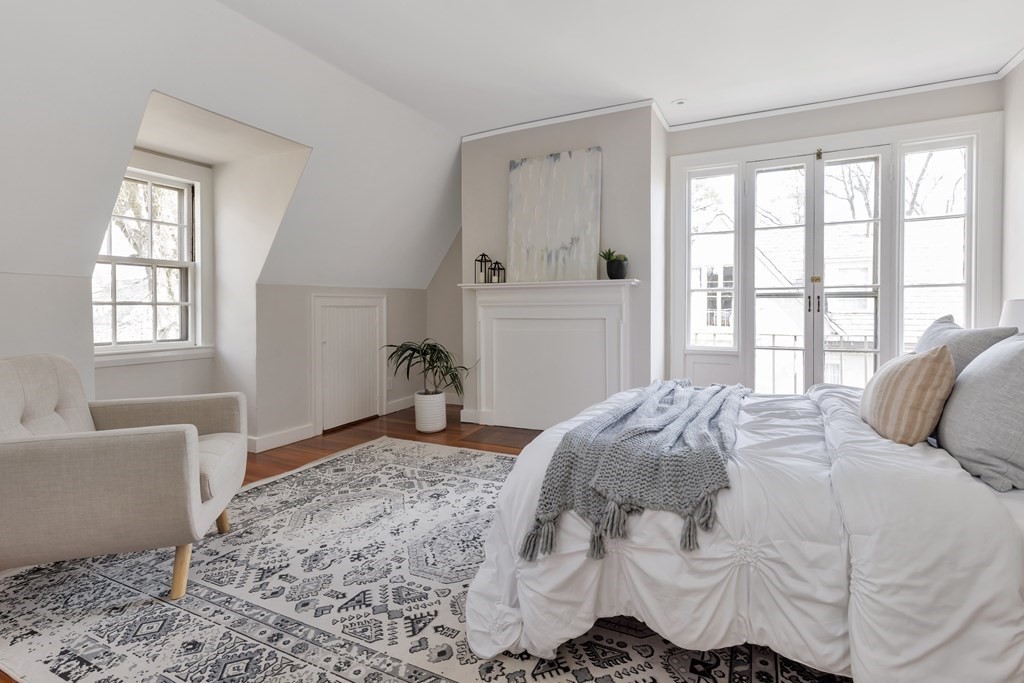 10 Shady Hill Square Cambridge, MA 02138 - Photo 23 of 37 a bedroom with a bed and a window with couch