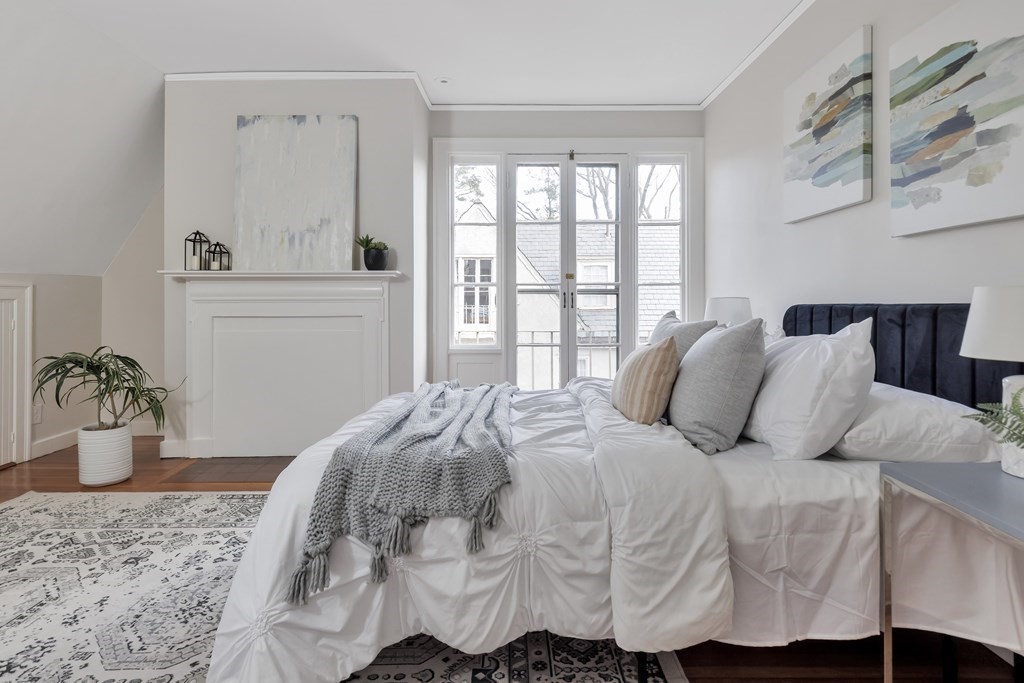 10 Shady Hill Square Cambridge, MA 02138 - Photo 24 of 37 a bedroom with a bed and window