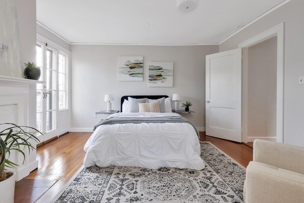 10 Shady Hill Square Cambridge, MA 02138 - Photo 25 of 37 a bedroom with a bed and a couch