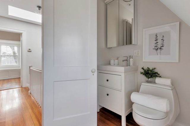 a bathroom with a sink toilet and vanity