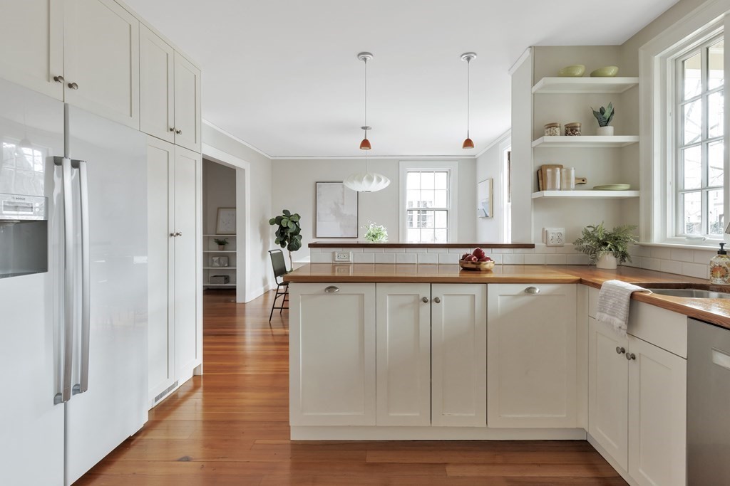 10 Shady Hill Square Cambridge, MA 02138 - Photo 8 of 37 a view of a kitchen with granite countertop a window and a counter space