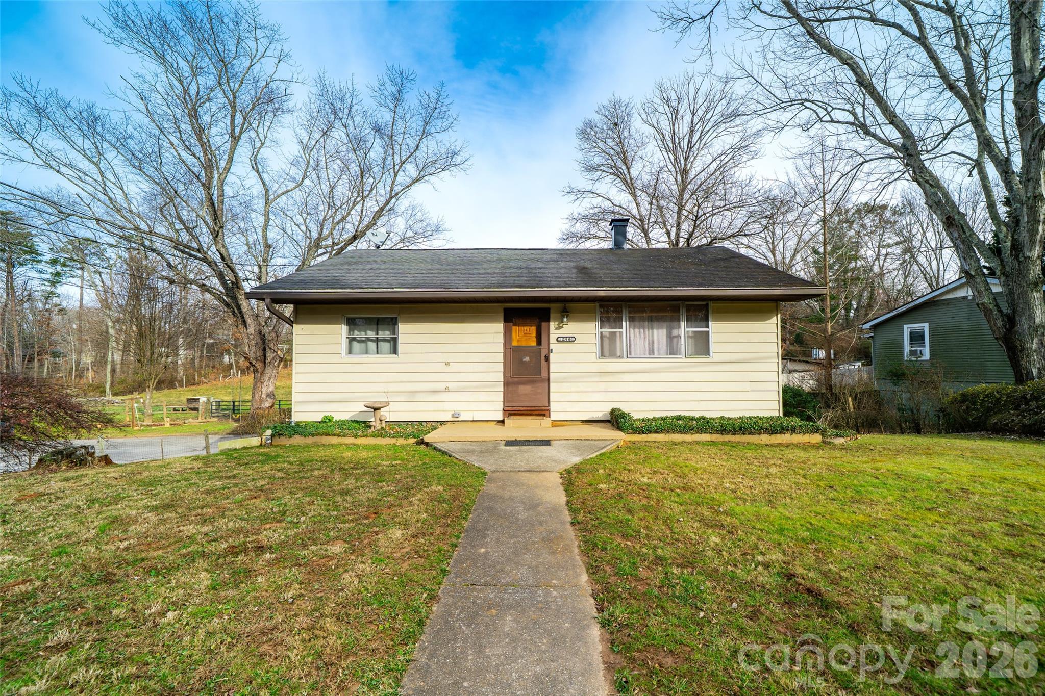 a view of a house with a yard
