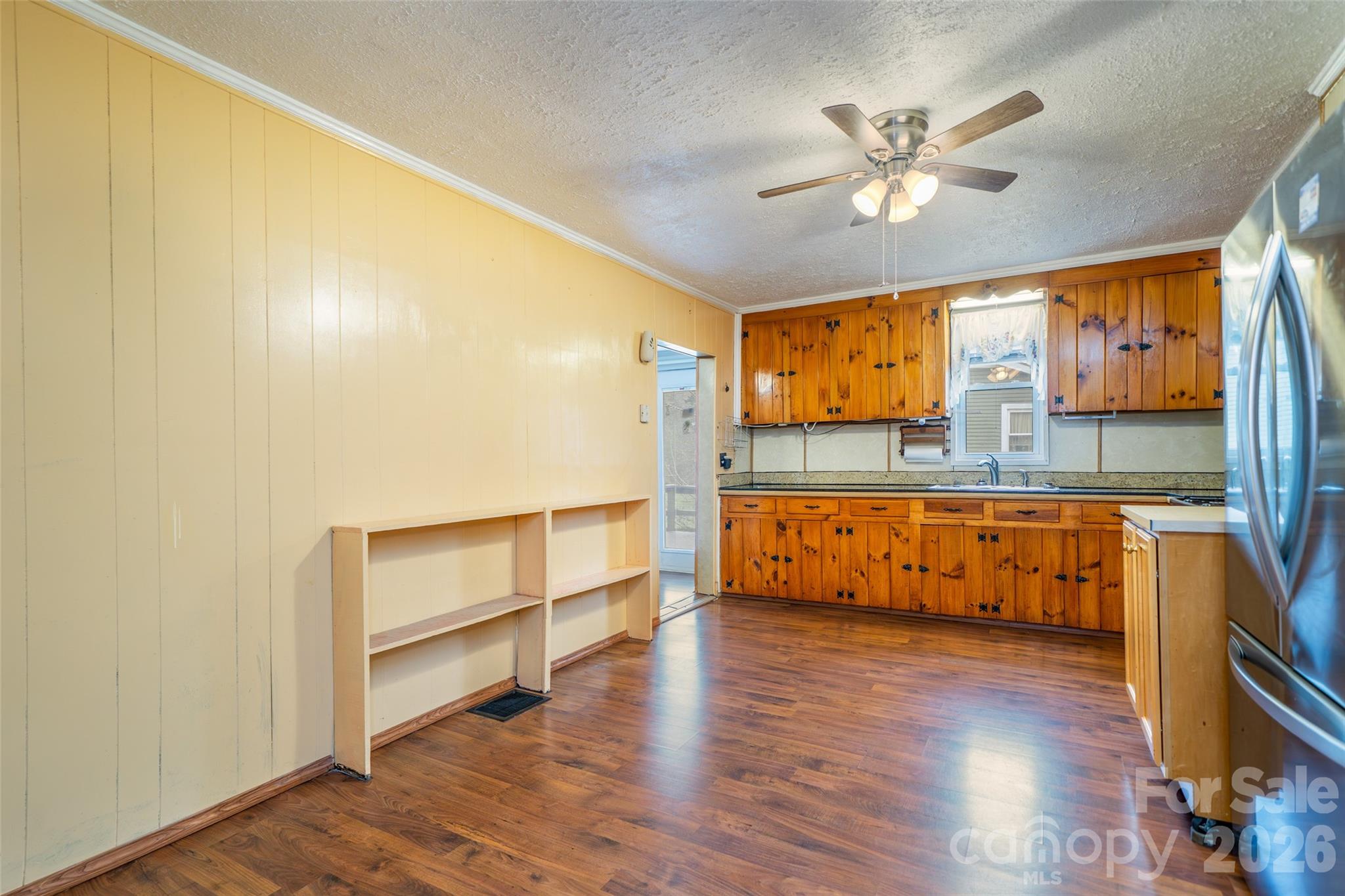 298 School Road East Asheville, NC 28803 - Photo 12 of 27 a view of room with wooden floor and fan