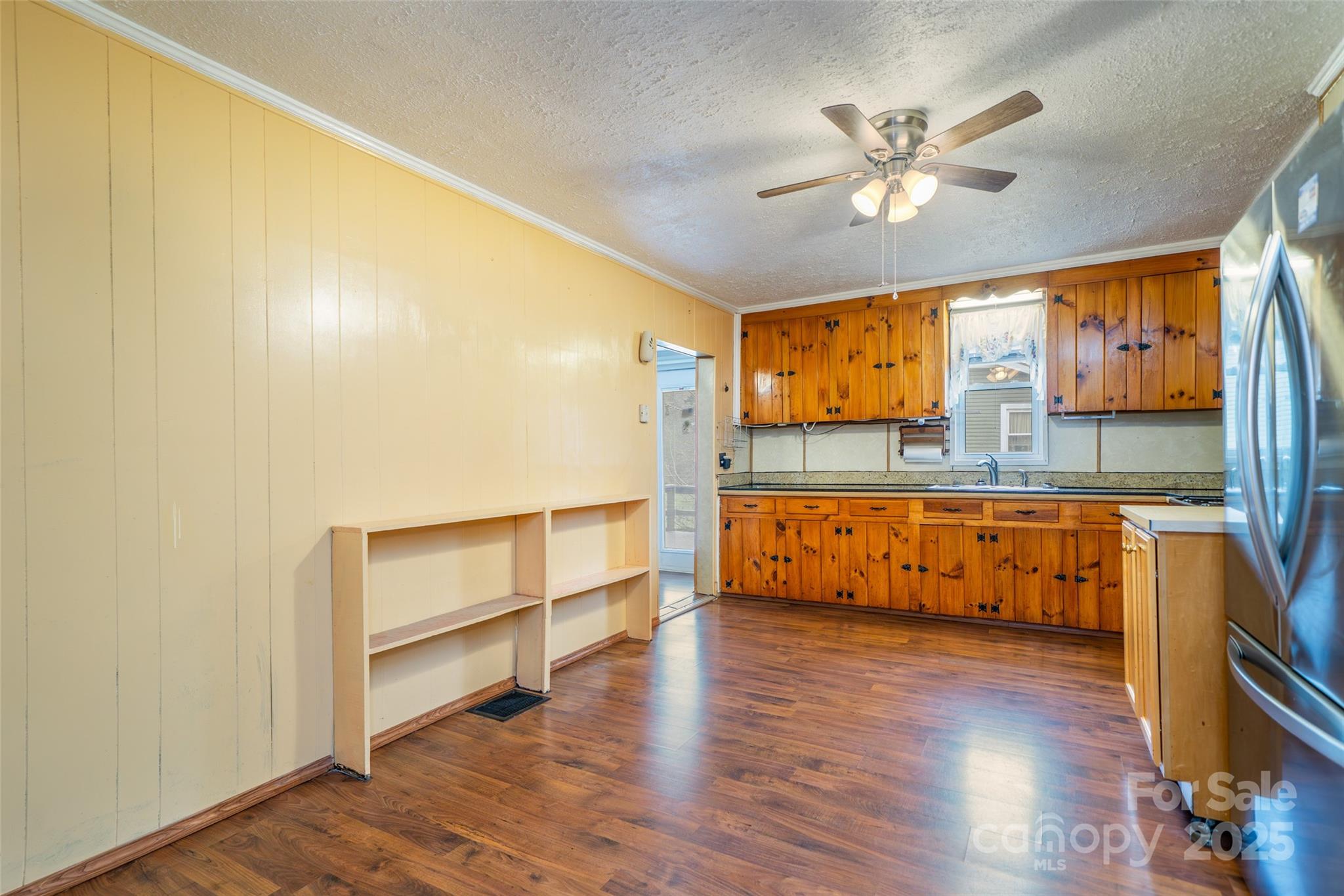 298 School Road East Asheville, NC 28803 - Photo 12 of 27 a view of room with wooden floor and fan