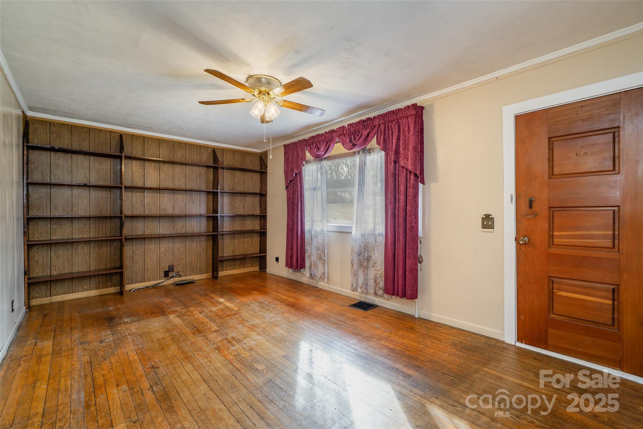 298 School Road East Asheville, NC 28803 - Photo 15 of 27 wooden floor and window in an empty room