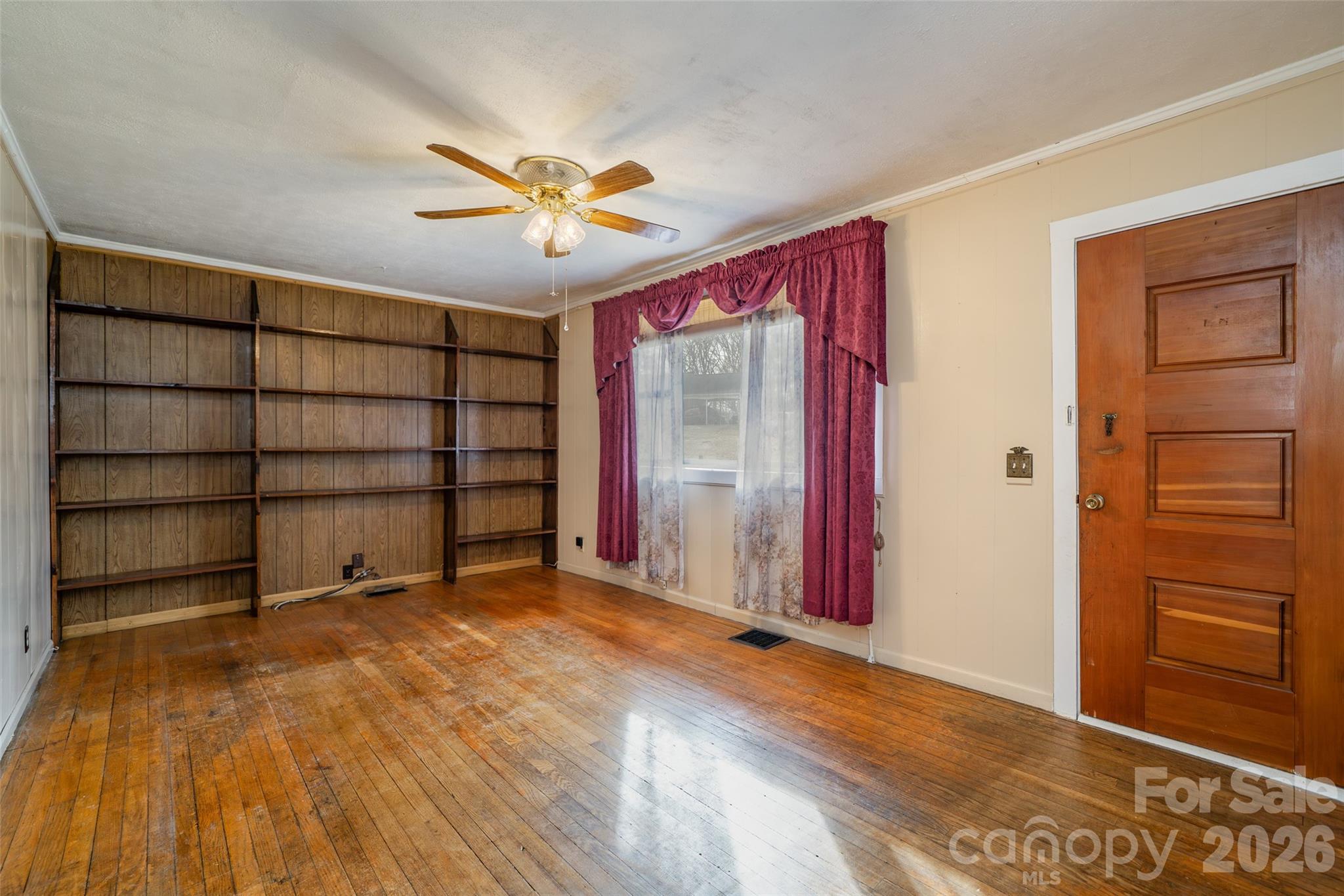 298 School Road East Asheville, NC 28803 - Photo 15 of 27 wooden floor and window in an empty room