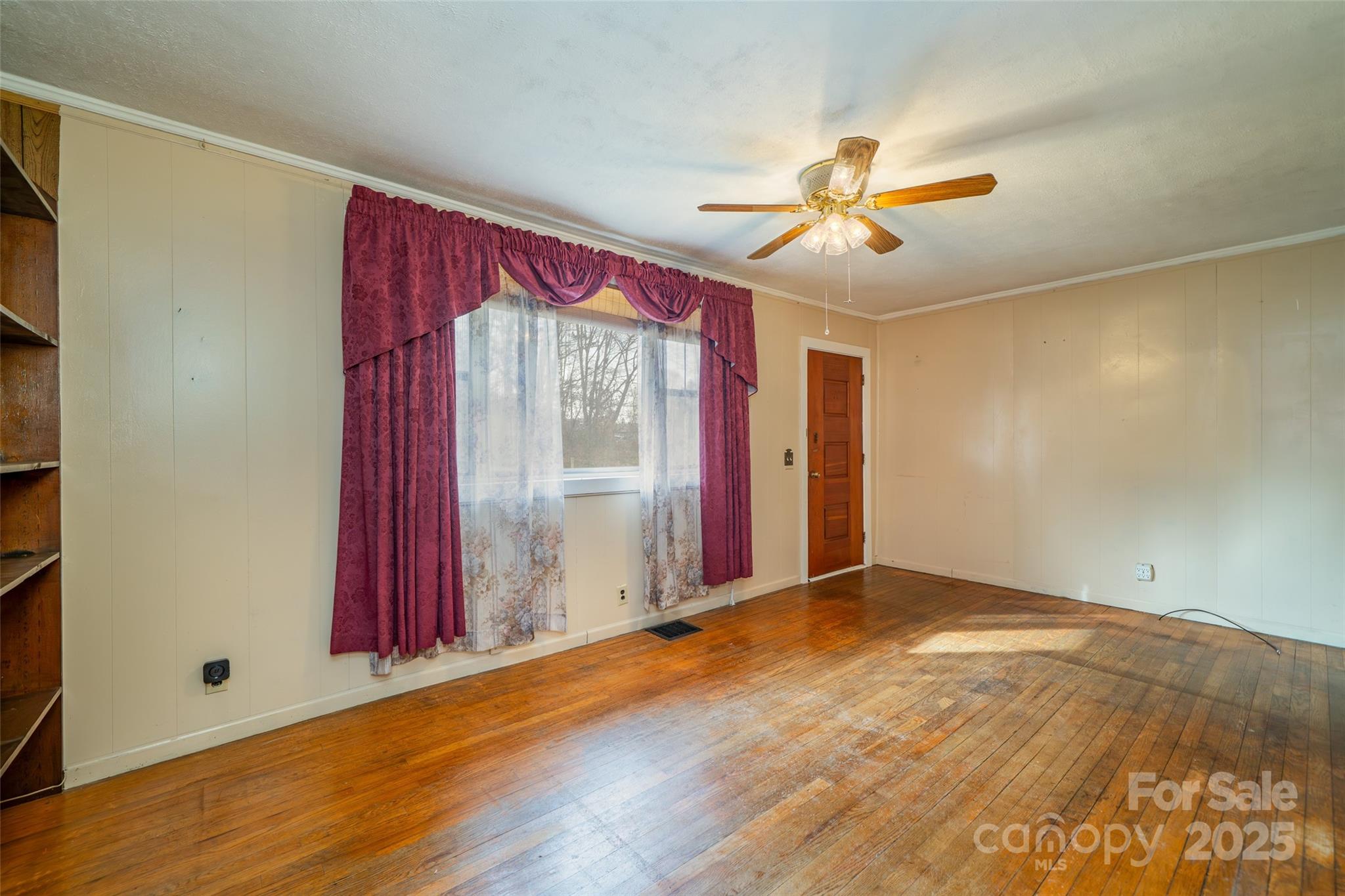 298 School Road East Asheville, NC 28803 - Photo 16 of 27 an empty room with windows and fan