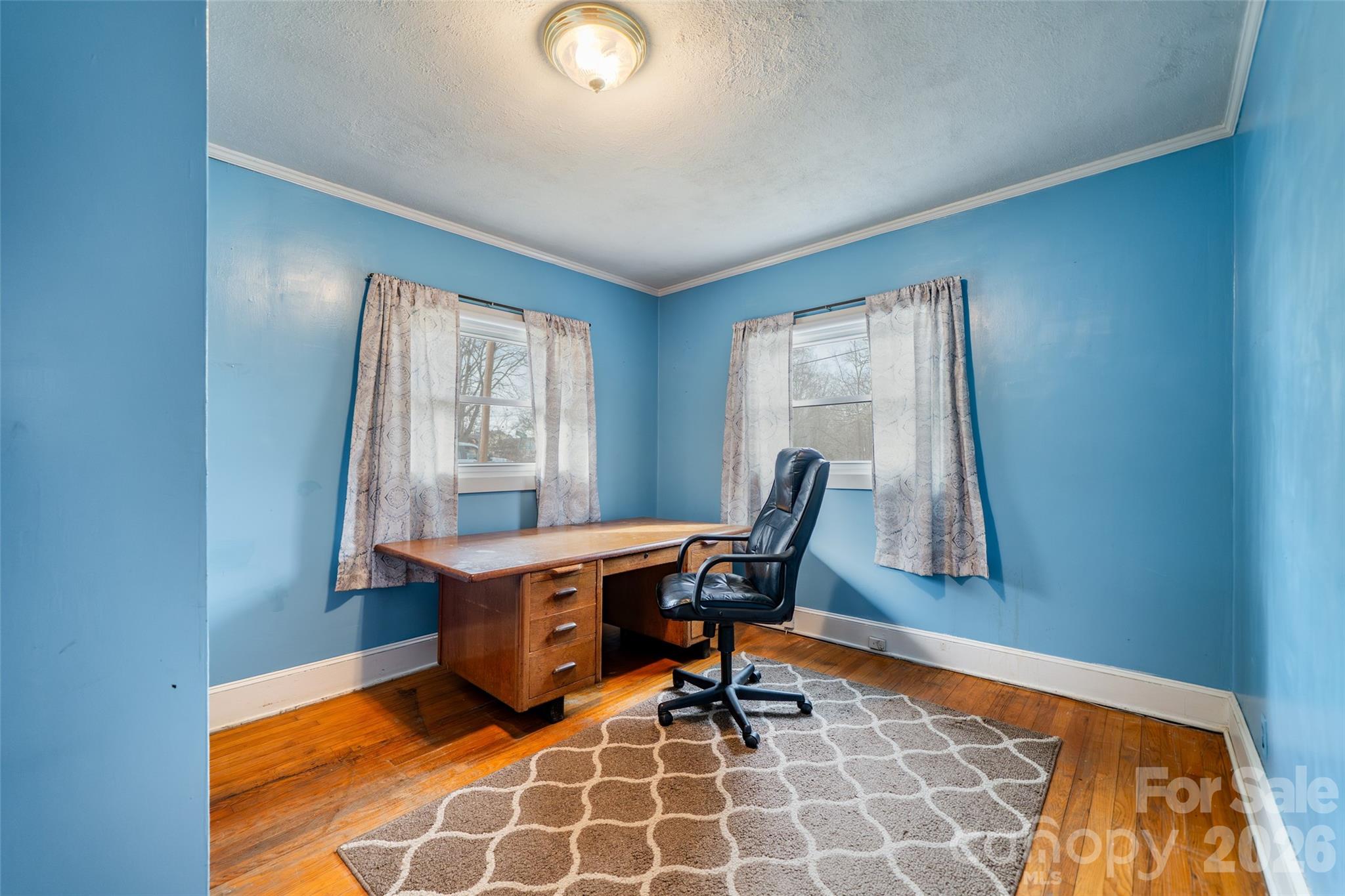 298 School Road East Asheville, NC 28803 - Photo 17 of 27 a view of a workspace with furniture and a window