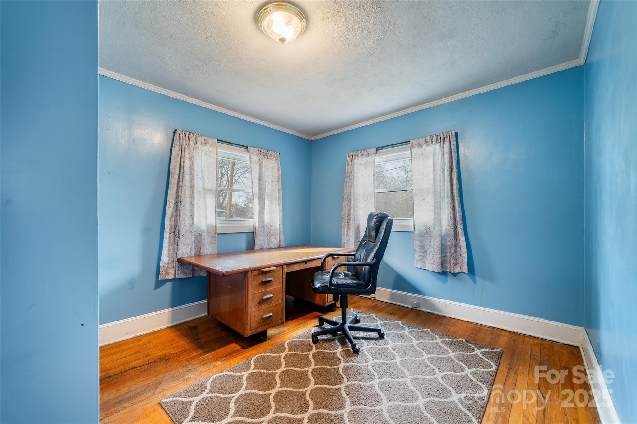 298 School Road East Asheville, NC 28803 - Photo 17 of 27 a view of a workspace with furniture and a window