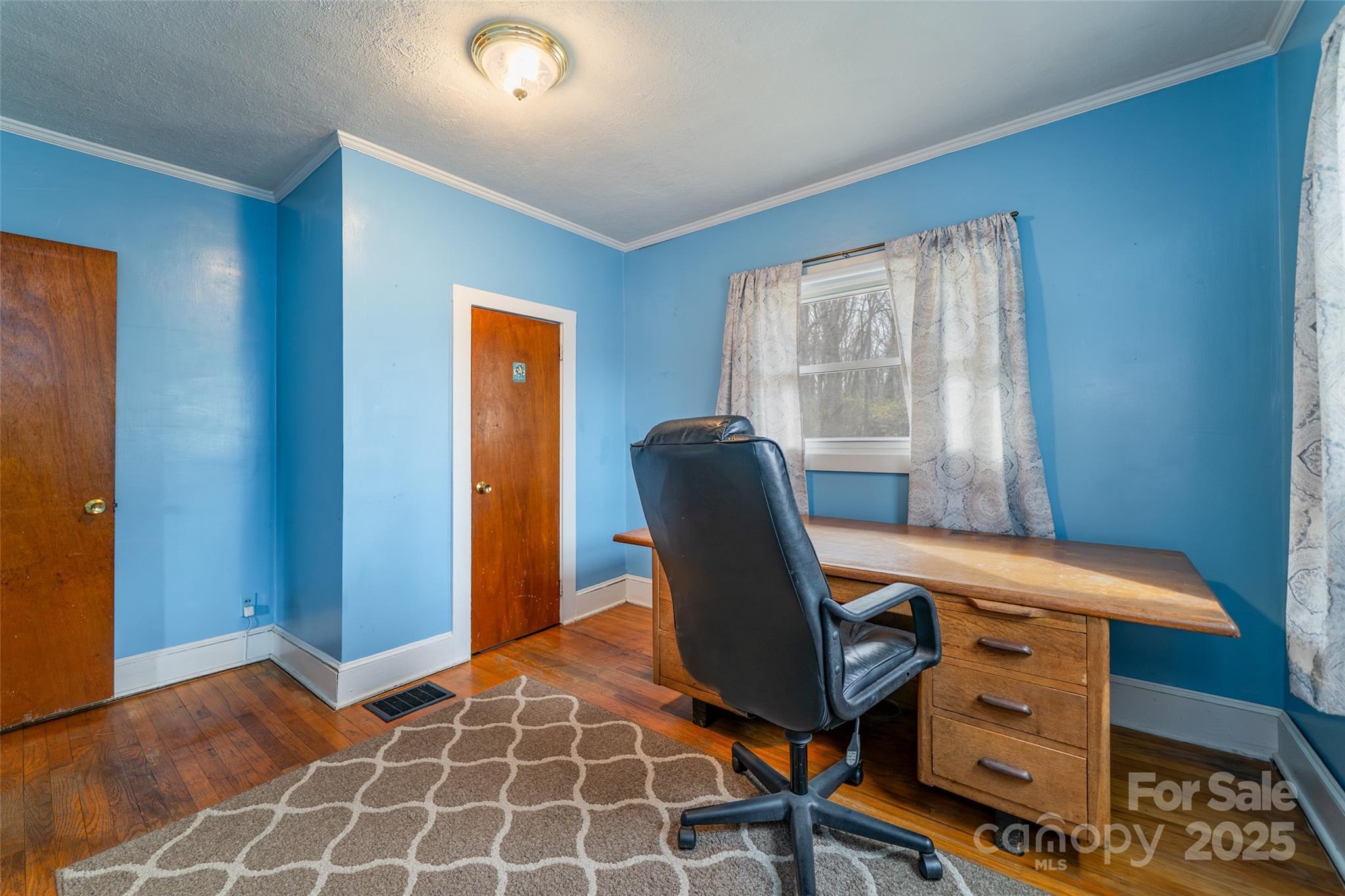 298 School Road East Asheville, NC 28803 - Photo 18 of 27 a view of a workspace with furniture and a window