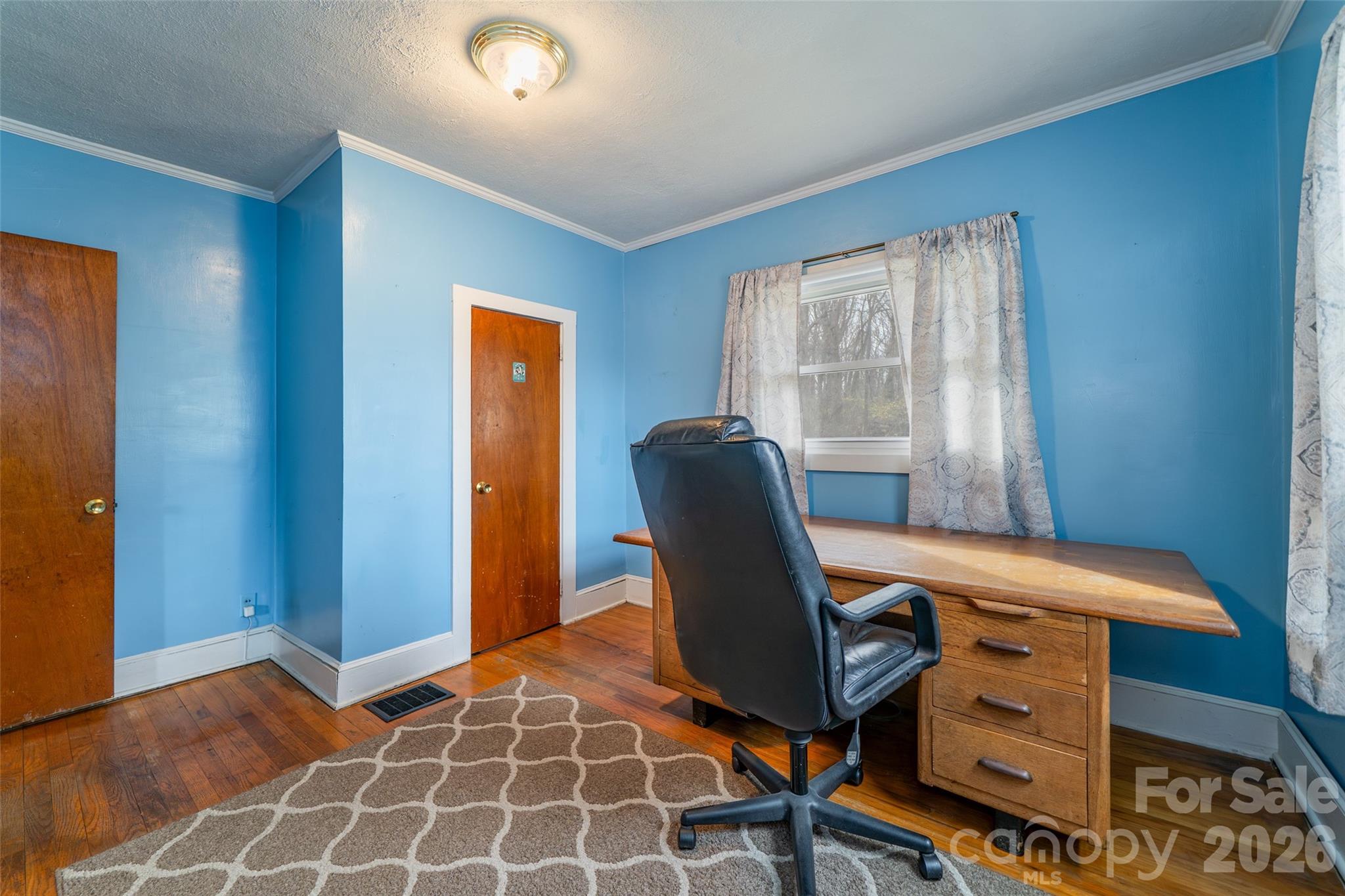 298 School Road East Asheville, NC 28803 - Photo 18 of 27 a view of a workspace with furniture and a window