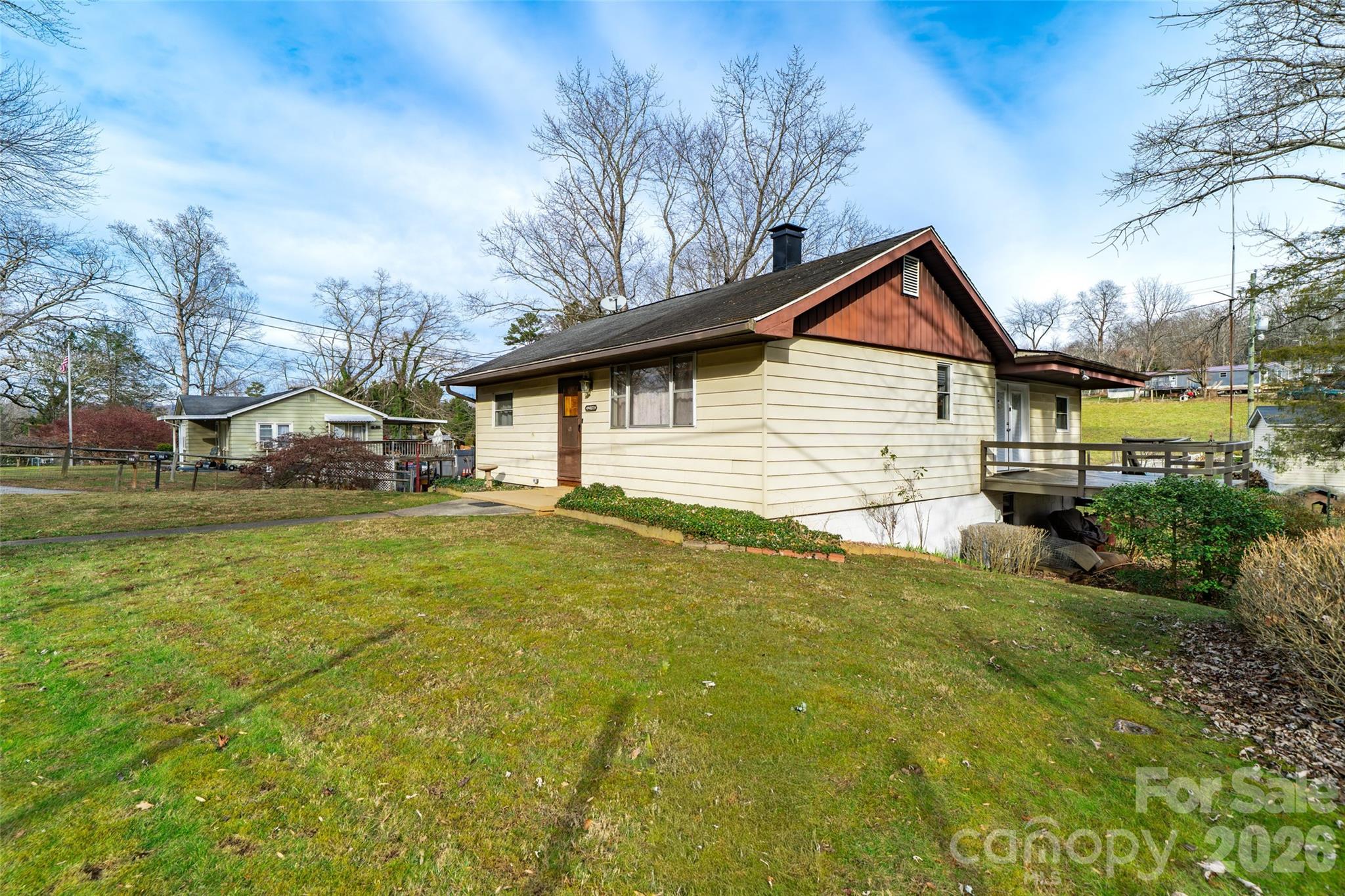 298 School Road East Asheville, NC 28803 - Photo 2 of 27 a front view of a house with a garden