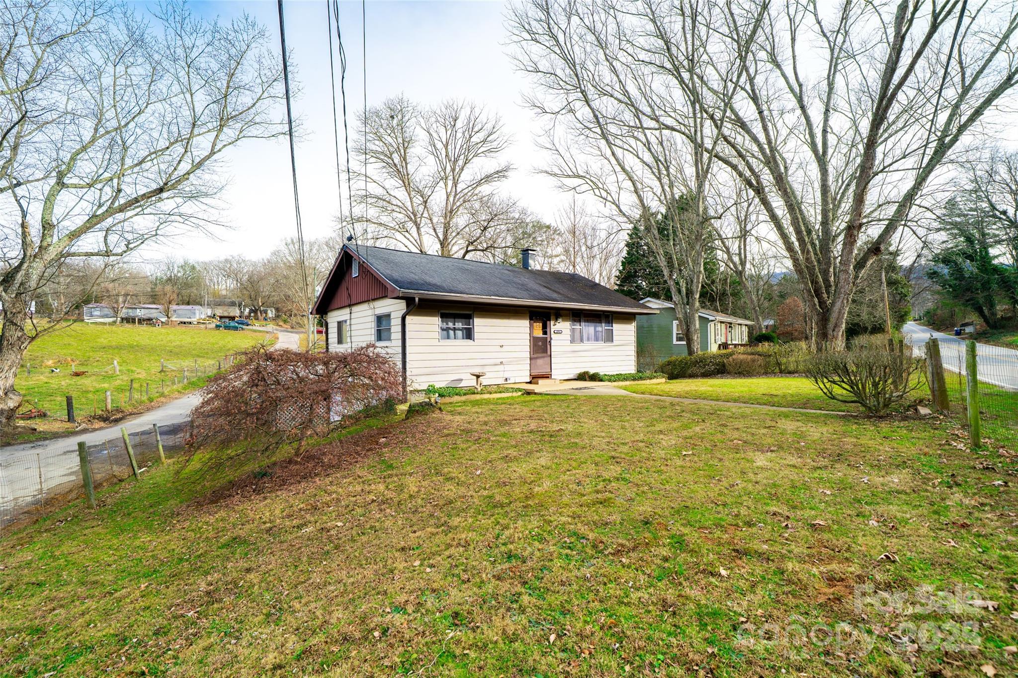 298 School Road East Asheville, NC 28803 - Photo 25 of 27 a house view with swimming pool in front of it