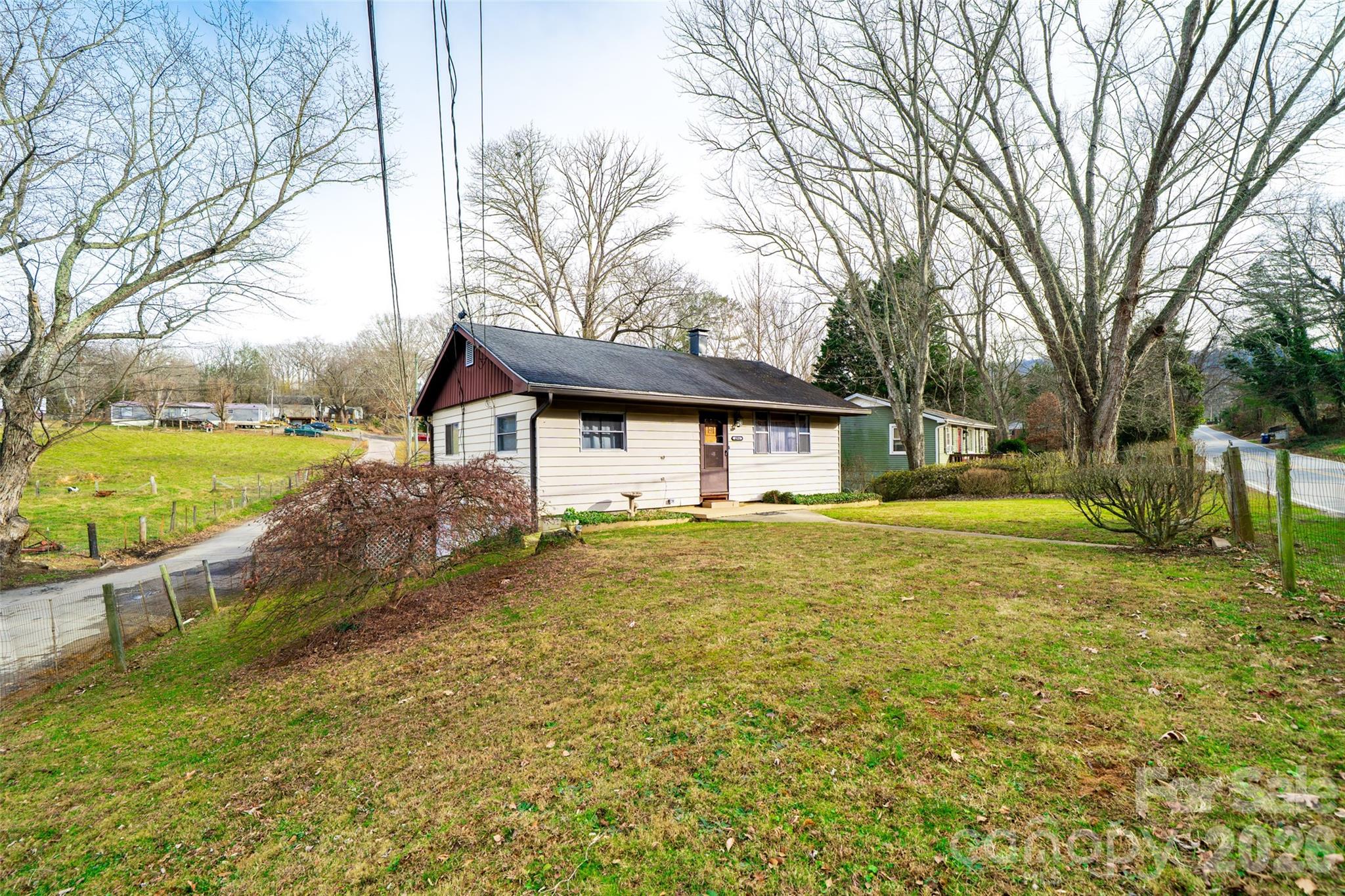 298 School Road East Asheville, NC 28803 - Photo 25 of 27 a house view with swimming pool in front of it