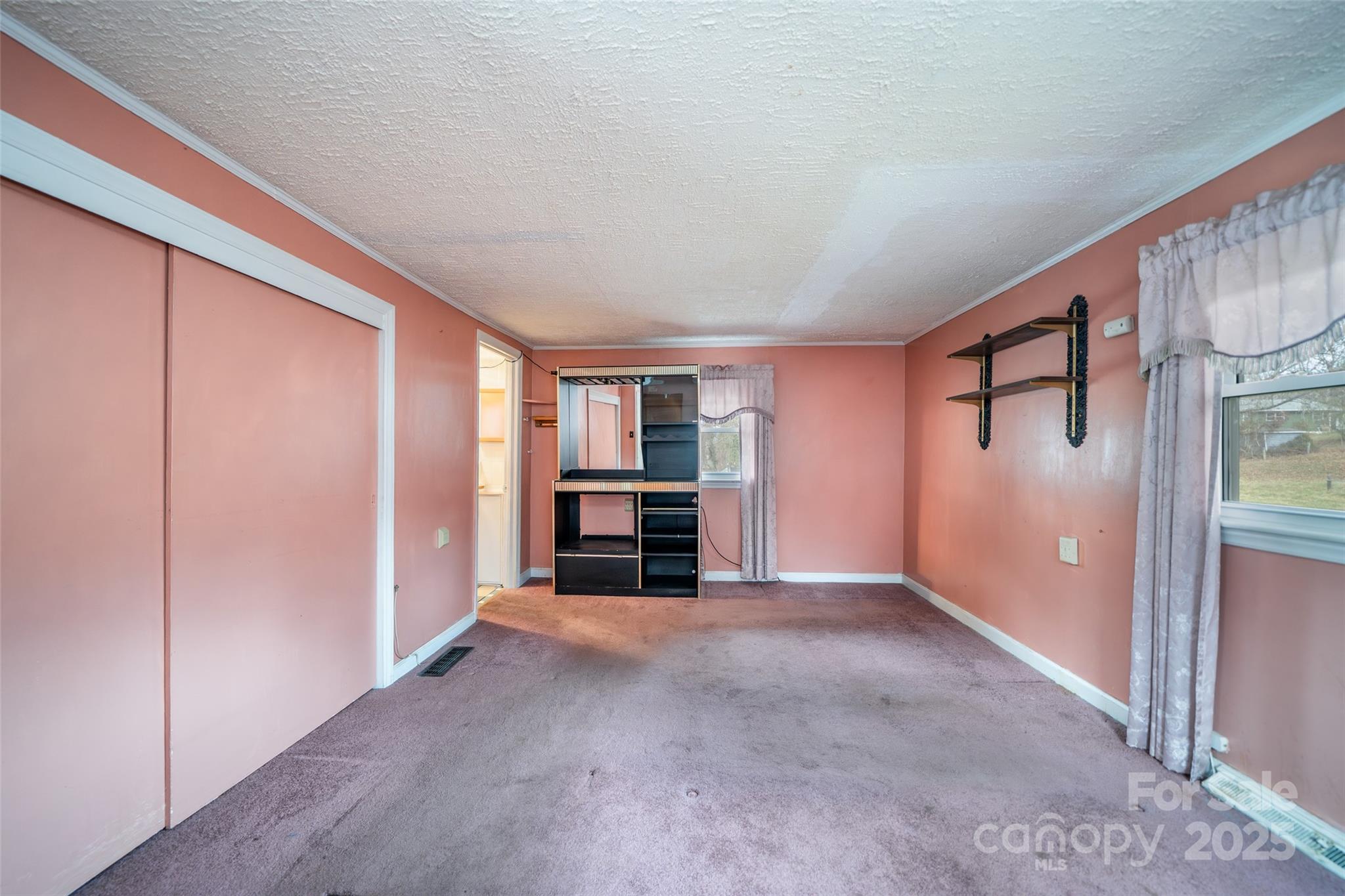 298 School Road East Asheville, NC 28803 - Photo 7 of 27 a view of a livingroom with furniture and closet