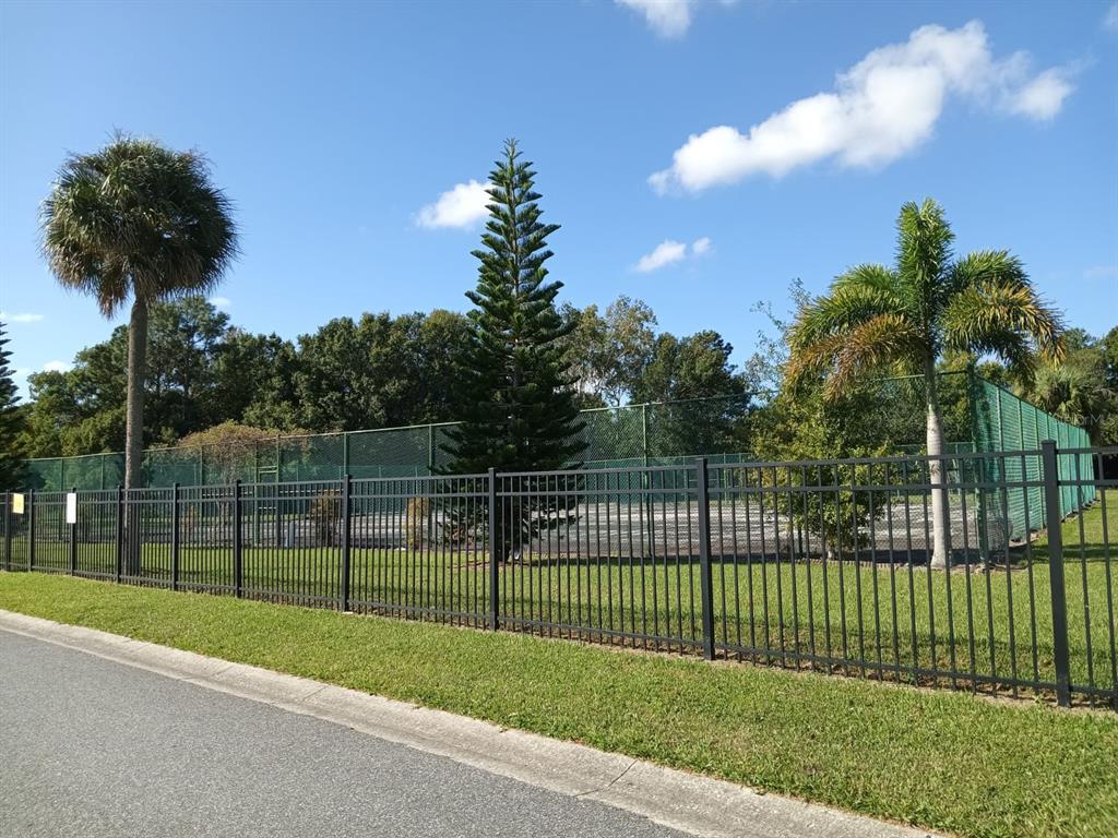 10700 Gardenwood Road Orlando, FL 32837 - Photo 22 of 23 a view of a park with iron fence