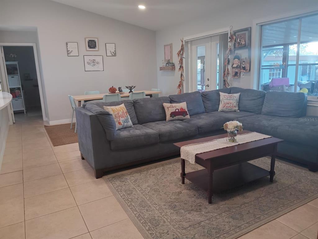 10700 Gardenwood Road Orlando, FL 32837 - Photo 9 of 23 a living room with furniture and a rug