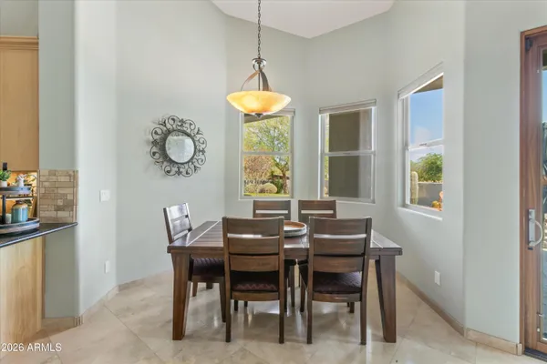 an aerial view of residential houses with outdoor space and mountain view