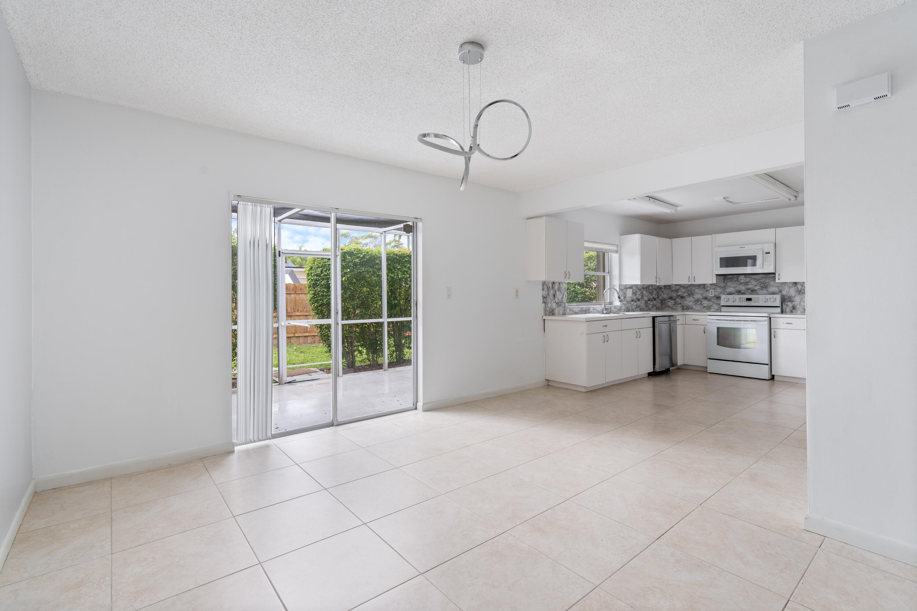 22707 Southwest 64th Way Boca Raton, FL 33428 - Photo 11 of 22 a view of a kitchen with a sink cabinets and a window