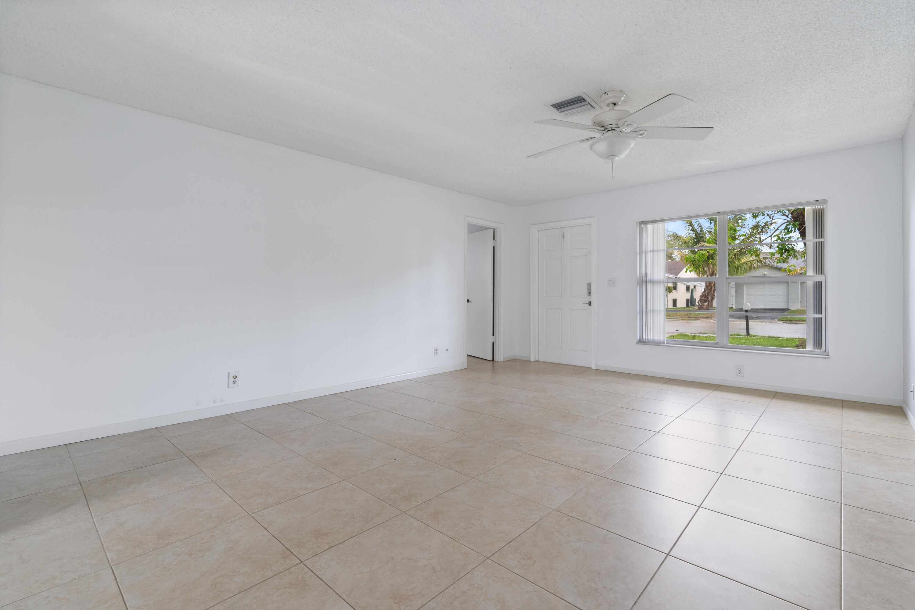 22707 Southwest 64th Way Boca Raton, FL 33428 - Photo 13 of 22 a view of an empty room with a window