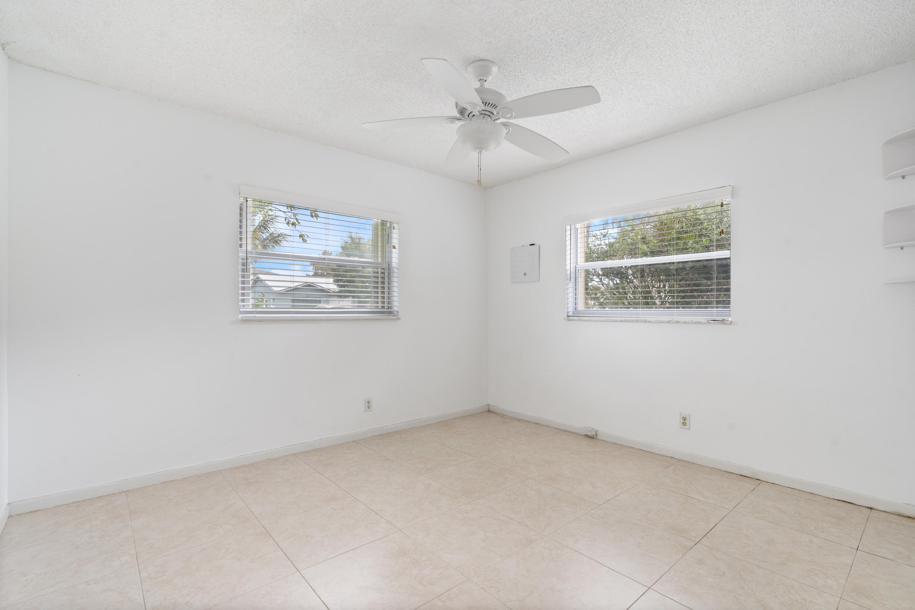 22707 Southwest 64th Way Boca Raton, FL 33428 - Photo 19 of 22 an empty room with a window