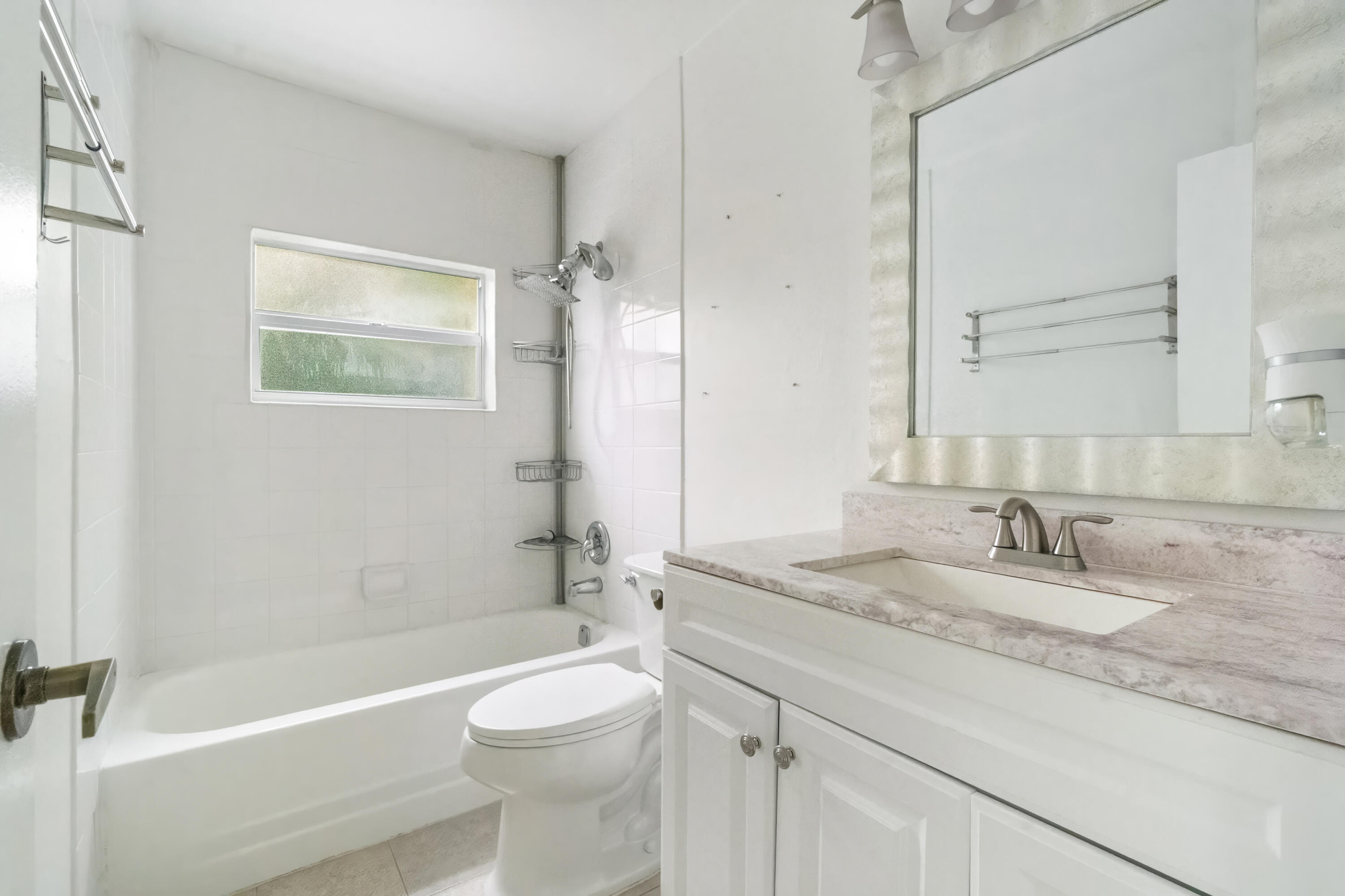 22707 Southwest 64th Way Boca Raton, FL 33428 - Photo 20 of 22 a bathroom with a granite countertop sink a toilet and shower
