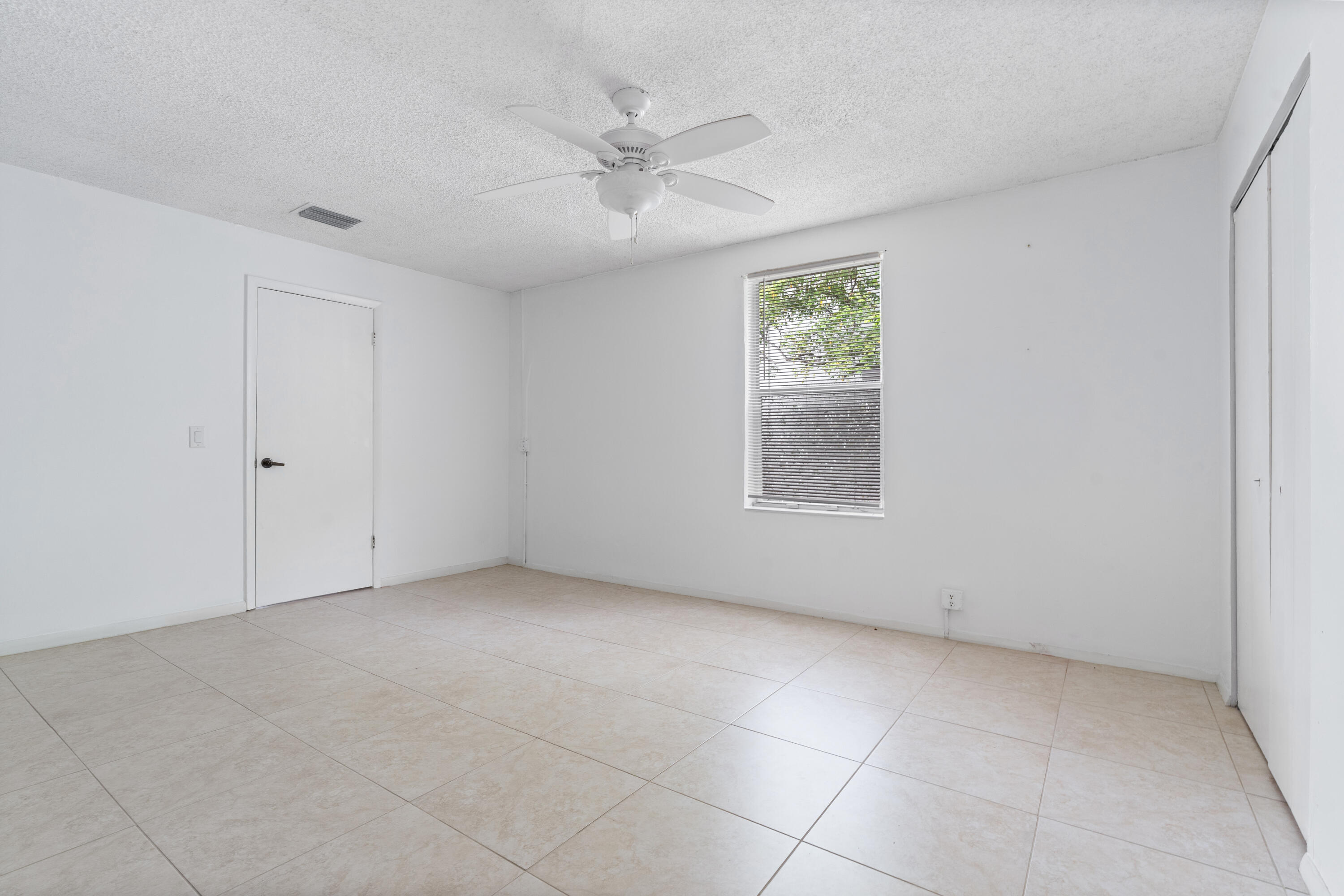 22707 Southwest 64th Way Boca Raton, FL 33428 - Photo 22 of 22 a view of an empty room with a window
