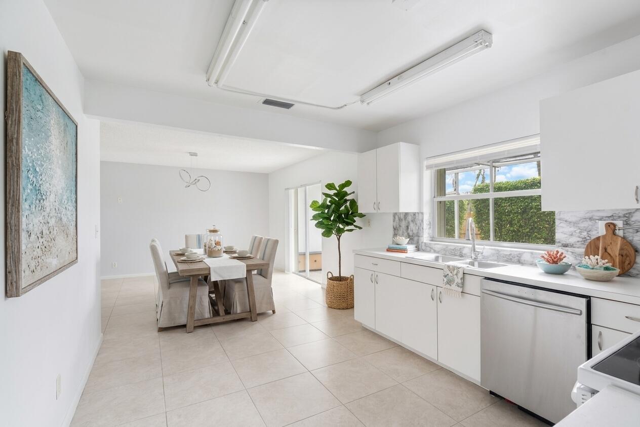 22707 Southwest 64th Way Boca Raton, FL 33428 - Photo 7 of 22 a kitchen with sink and cabinets