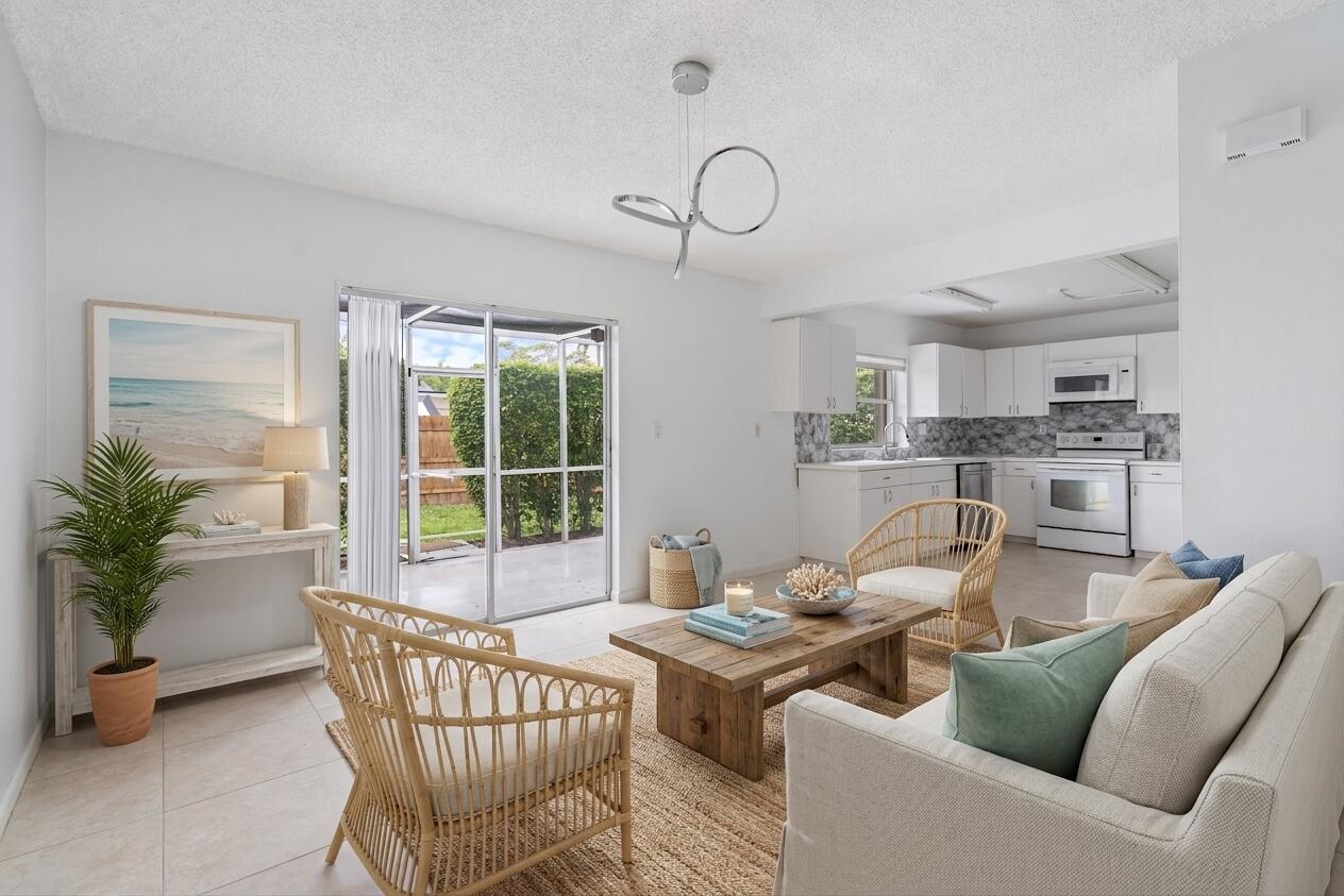 22707 Southwest 64th Way Boca Raton, FL 33428 - Photo 10 of 22 a living room with furniture a window and a table