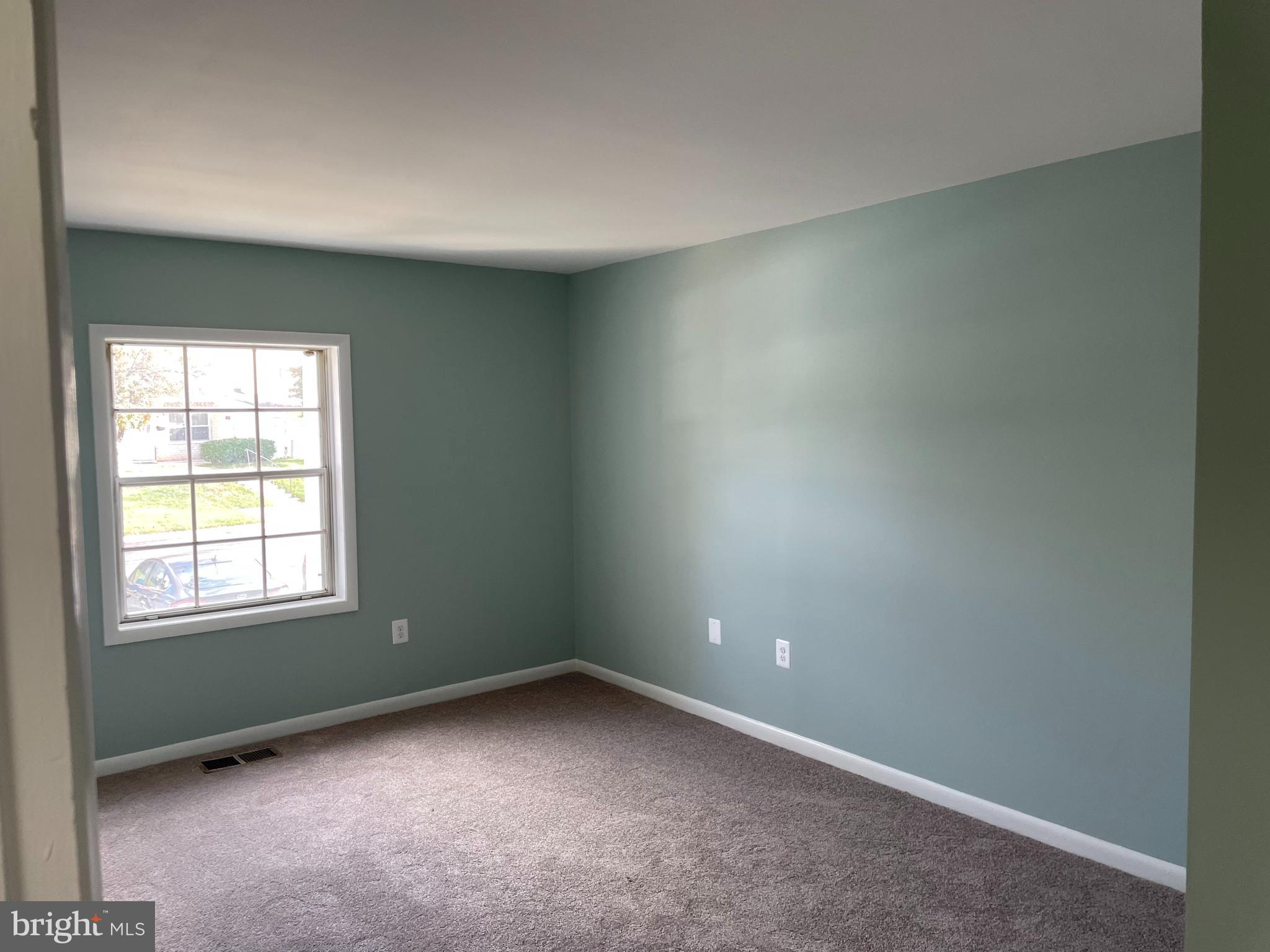 9220 Bridle Path Lane, Unit E Laurel, MD 20723 - Photo 11 of 14 an empty room with a window