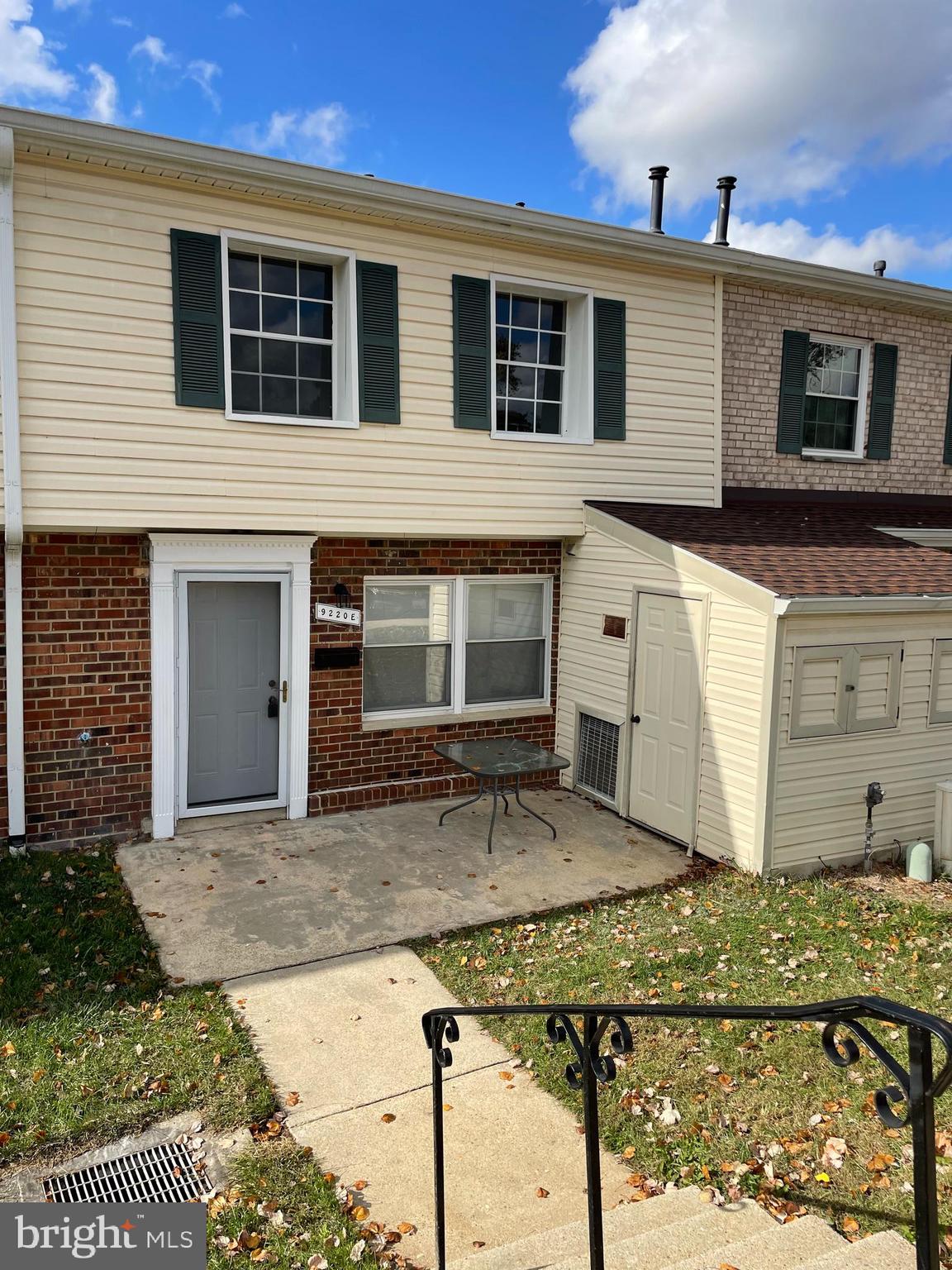 9220 Bridle Path Lane, Unit E Laurel, MD 20723 - Photo 2 of 14 a front view of a house with garden