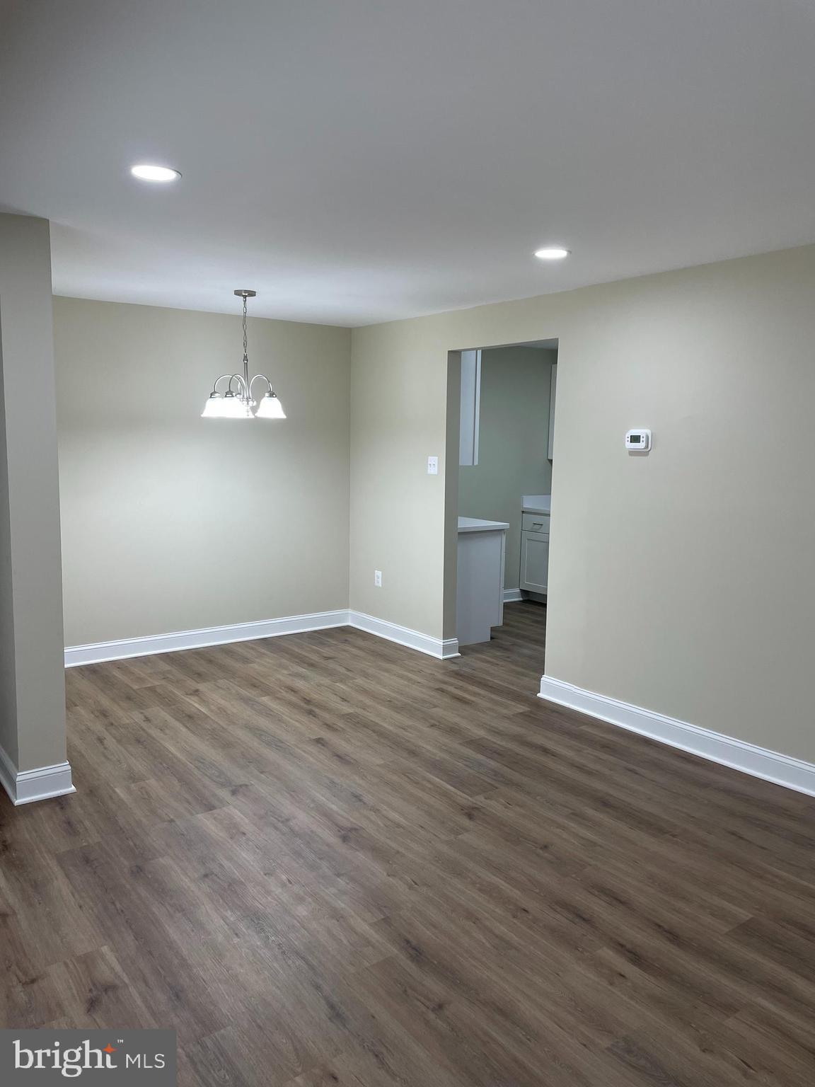 9220 Bridle Path Lane, Unit E Laurel, MD 20723 - Photo 7 of 14 a view of empty room with wooden floor