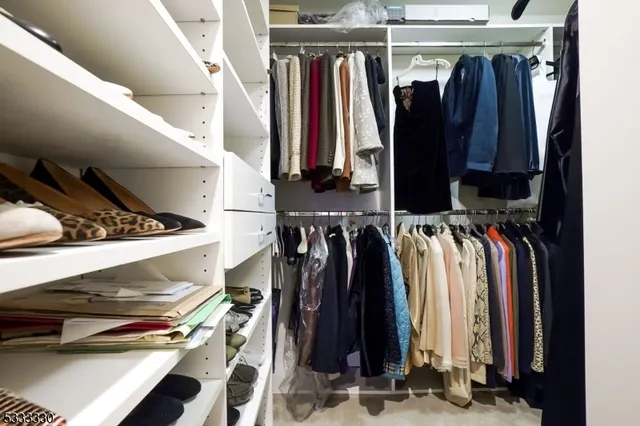 a bathroom with a double vanity sink mirror and bathtub