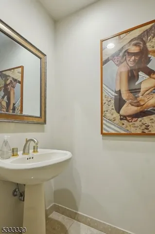 a kitchen with cabinets stainless steel appliances and sink