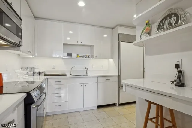 a kitchen with a sink and cabinets