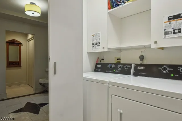 a bedroom with a bed couch and window