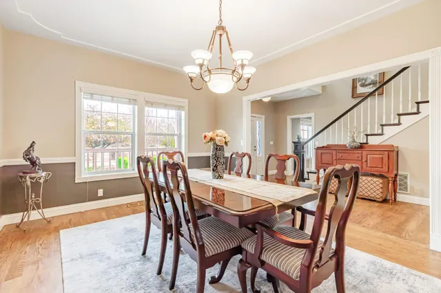 a view of a yard with wooden fence