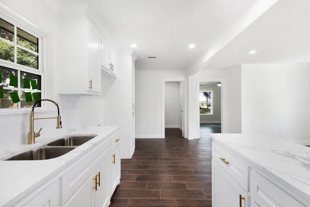 a kitchen with a sink and cabinets
